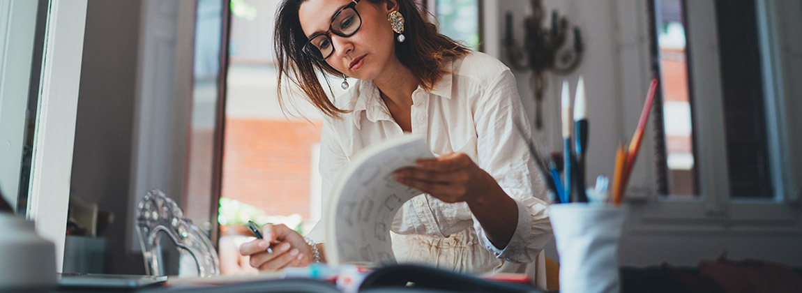 woman looking through documents